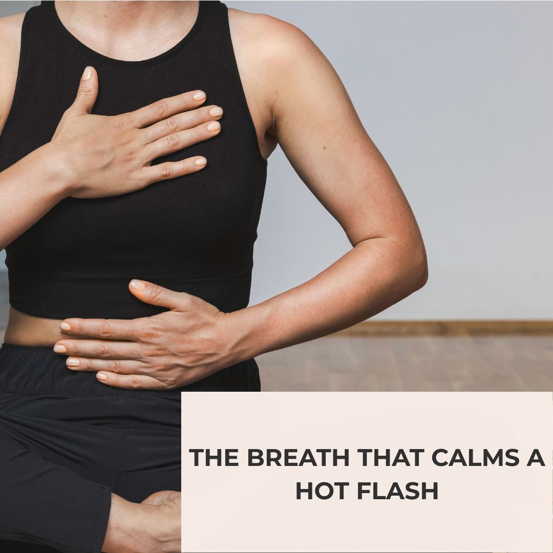 A woman with one hand on her chest and one on her belly, breathing through a hot flash.