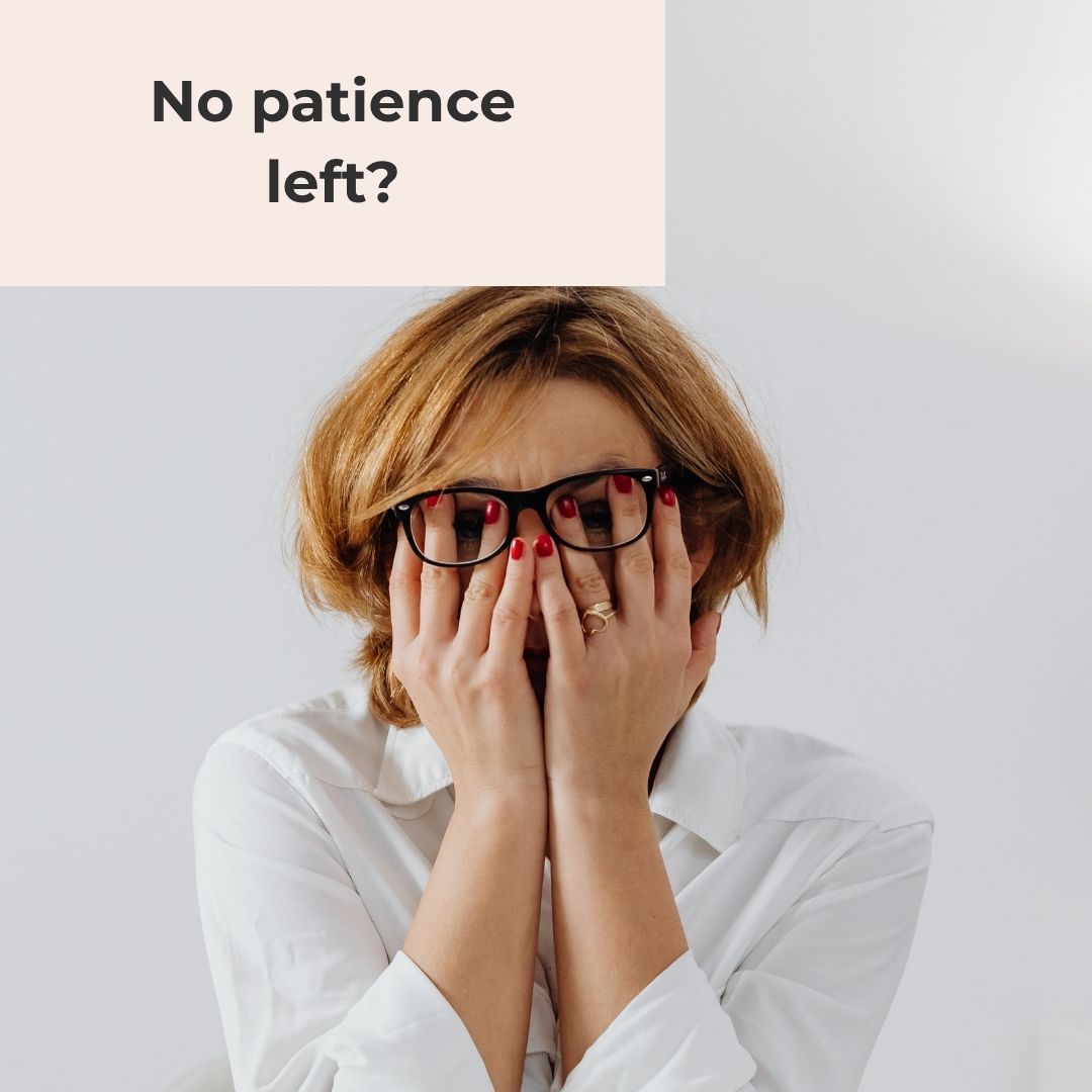 Woman in a white shirt and glasses covering her face with her hands, frustrated, with the words "No patience left?"